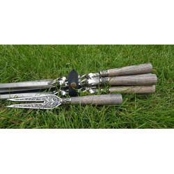 A set of 6 skewers, with a...
